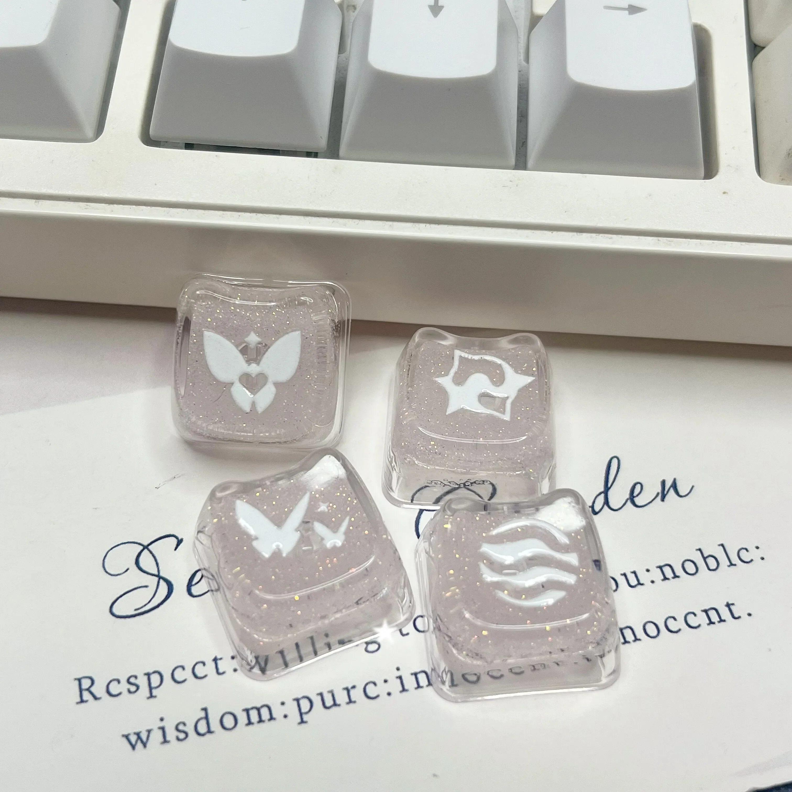 Enchanting Valorant keycaps from various angles, highlighting the sparkling pink translucent glitter skill keys for mechanical keyboards.