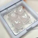 Enchanting Valorant Keycaps, vividly displaying the translucent pink glitter and unique cat ear design on mechanical keyboard skill keys.