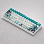 Showcasing the exclusive Valorant Sage-themed PBT keycap set from various perspectives, emphasizing its iconic green hues and durable gaming quality.