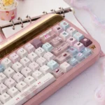 Velvet Frosted Strawberry Keycaps Set gallery: PBT+PC translucent design, glowing sweetly. Multiple artistic views highlight whimsical frosted texture.