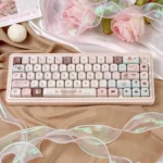 Gallery view of Velvet Frosted Strawberry Keycaps Set, featuring their PBT+PC translucent material, frosted texture, and whimsical, artistic glow.