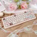 A collection of Velvet Frosted Strawberry PBT+PC translucent keycaps set showcasing their unique design and ethereal glow from various artistic angles.