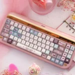 Artistic display of Velvet Frosted Strawberry Keycap Set, showcasing their PBT+PC translucent glow and sweet frosted texture from various angles.