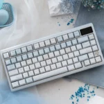 Artistic Winter Letter Keycaps set, displaying a unique, tranquil snowy design in soft blue and white durable PBT+PC for custom mechanical keyboards.