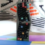 Ag1921 Braun-inspired PBT Wooting keycaps set showcasing a sleek, minimalist design with dark tones and precise legends, highlighting premium compatibility.