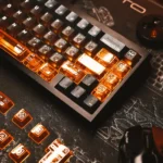 X-Era Dream Boundary Keycap Set gallery displays front-engraved translucent PC caps glowing vibrant orange, creating a dark sci-fi design.