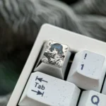 This Ryo Yamada titanium keycap product gallery highlights the vibrant, precision-engraved anime art and premium, durable metallic finish.