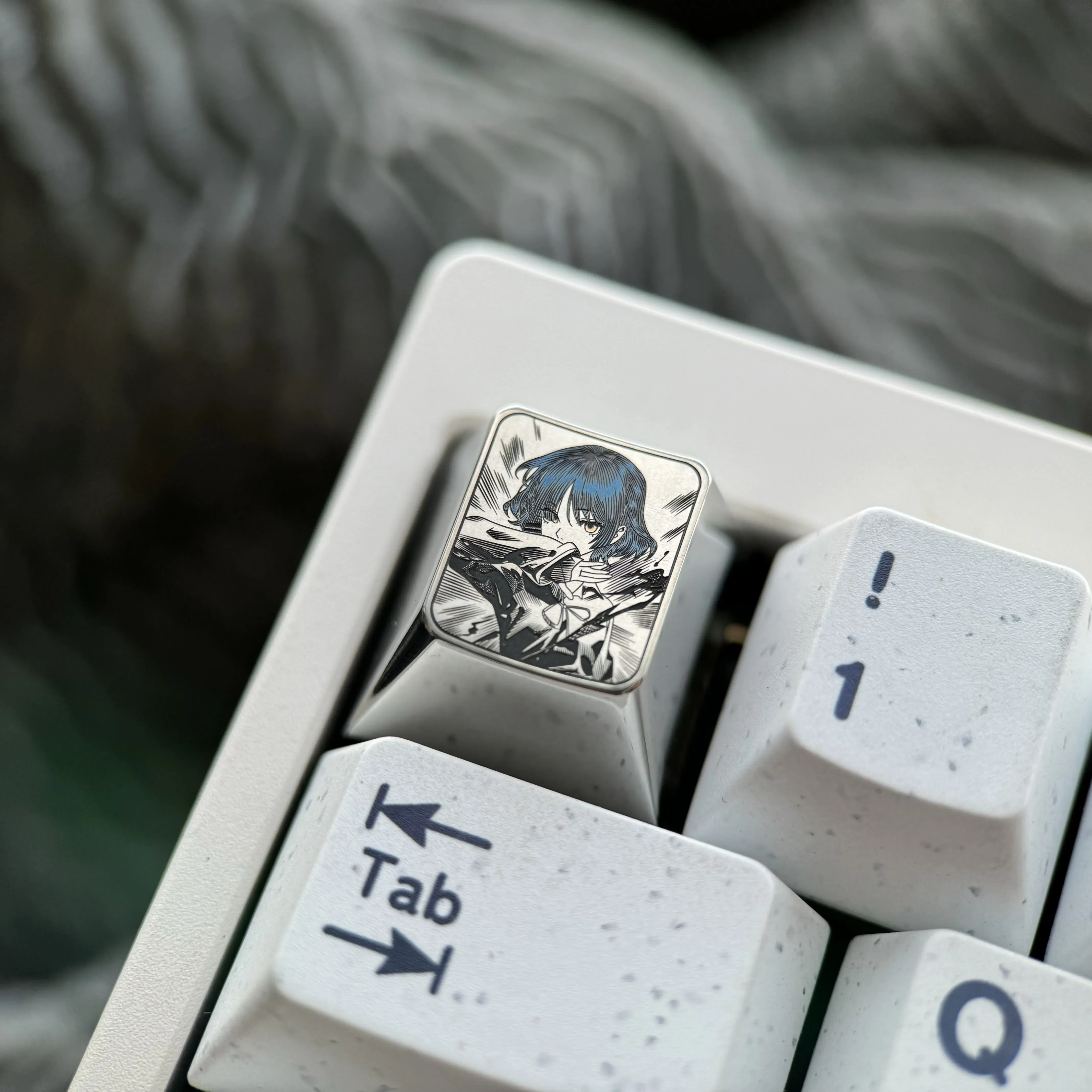 This Ryo Yamada titanium keycap product gallery highlights the vibrant, precision-engraved anime art and premium, durable metallic finish.