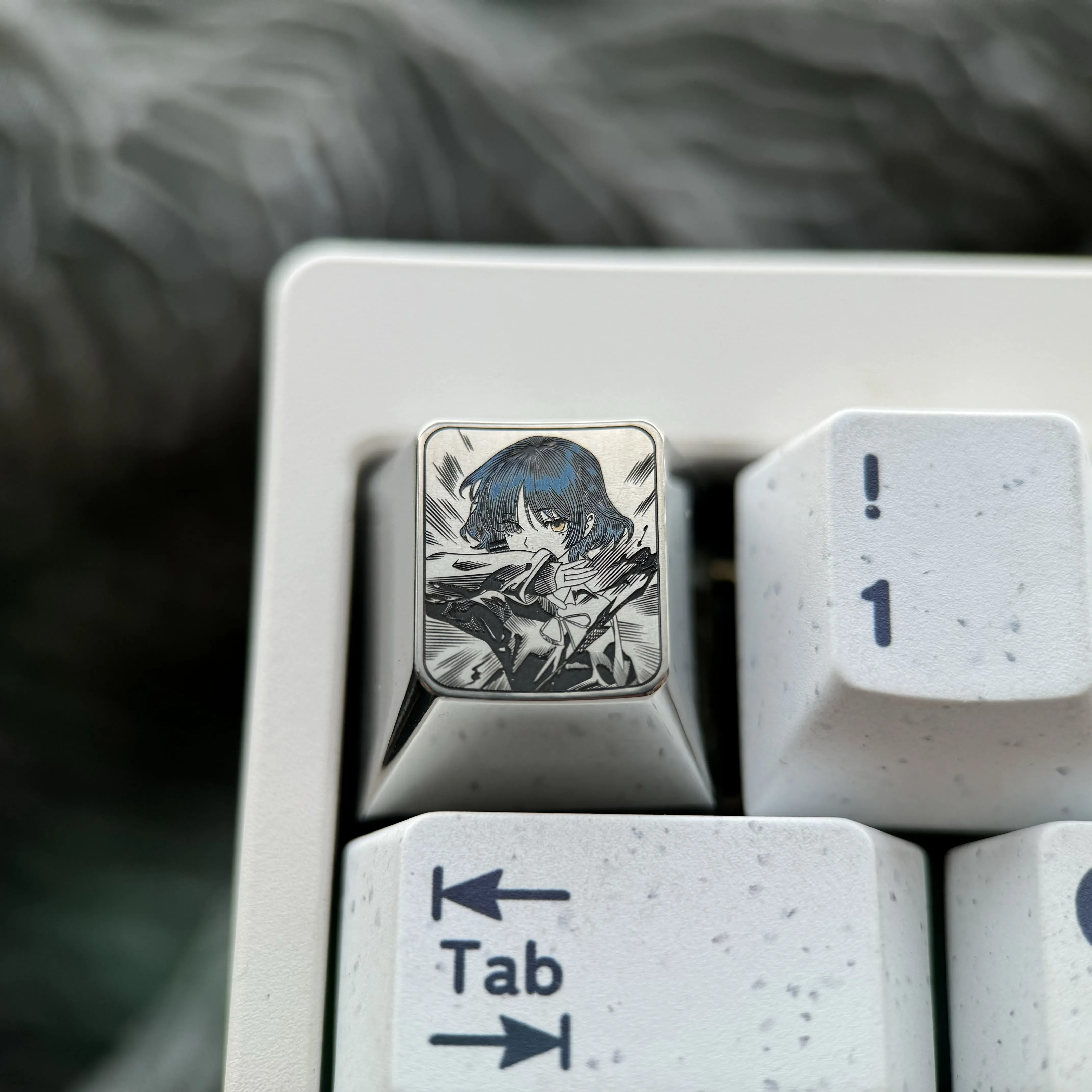Yamada Ryo titanium ESC keycap gallery showcasing its precision-engraved anime art from multiple angles. Detailed craftsmanship on durable titanium.
