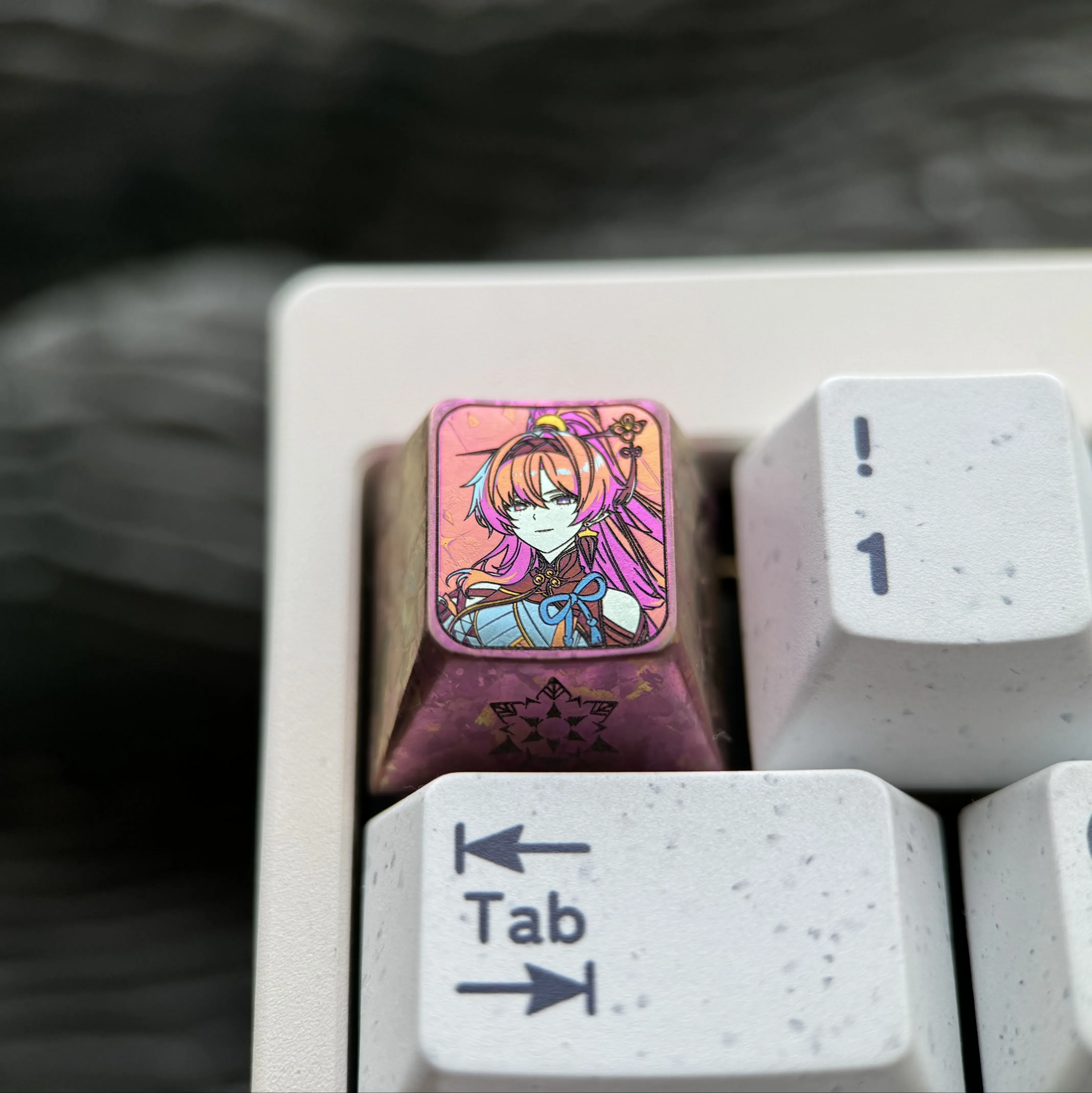 Exclusive Yinlin titanium alloy keycap for Wuthering Waves fans, displaying its intricate anime ESC design and vibrant premium finish.