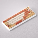 Gallery views of the Fiery Spirit Yoimiya Keycaps Set, highlighting exclusive Genshin Impact PBT keycaps with vibrant Yoimiya art and fiery fireworks.