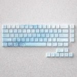 Ethereal Yuki-onna Keycaps Set: A PBT set featuring mystical snow maiden art in icy blues, inspired by Japanese folklore.