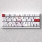 Iconic Zero Two PBT keycap set with vibrant pink and white dye-sub legends, showcasing the Darling in the Franxx anime aesthetic.