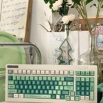 Alhaitham Keycaps Set: Scribe's Elegance exclusive full set, showcasing signature green, grey, gold colors and intricate Scribe motifs.