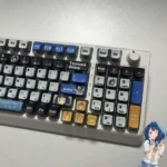 Close-up of the Anna Yanami translucent RGB anime keycaps set, vividly illuminating individual character art and the playful, personalized aesthetic.