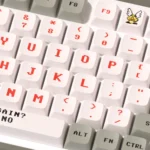 Iconic Mario Arcade PBT dye-sub keycaps set, captured from various angles, display vibrant retro pixel art of beloved Mario characters and game elements.