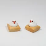 A detailed view of the exquisite handcrafted 3D artisan Java Sparrow keycap from a different angle, showcasing its intricate miniature scene and textured mat.