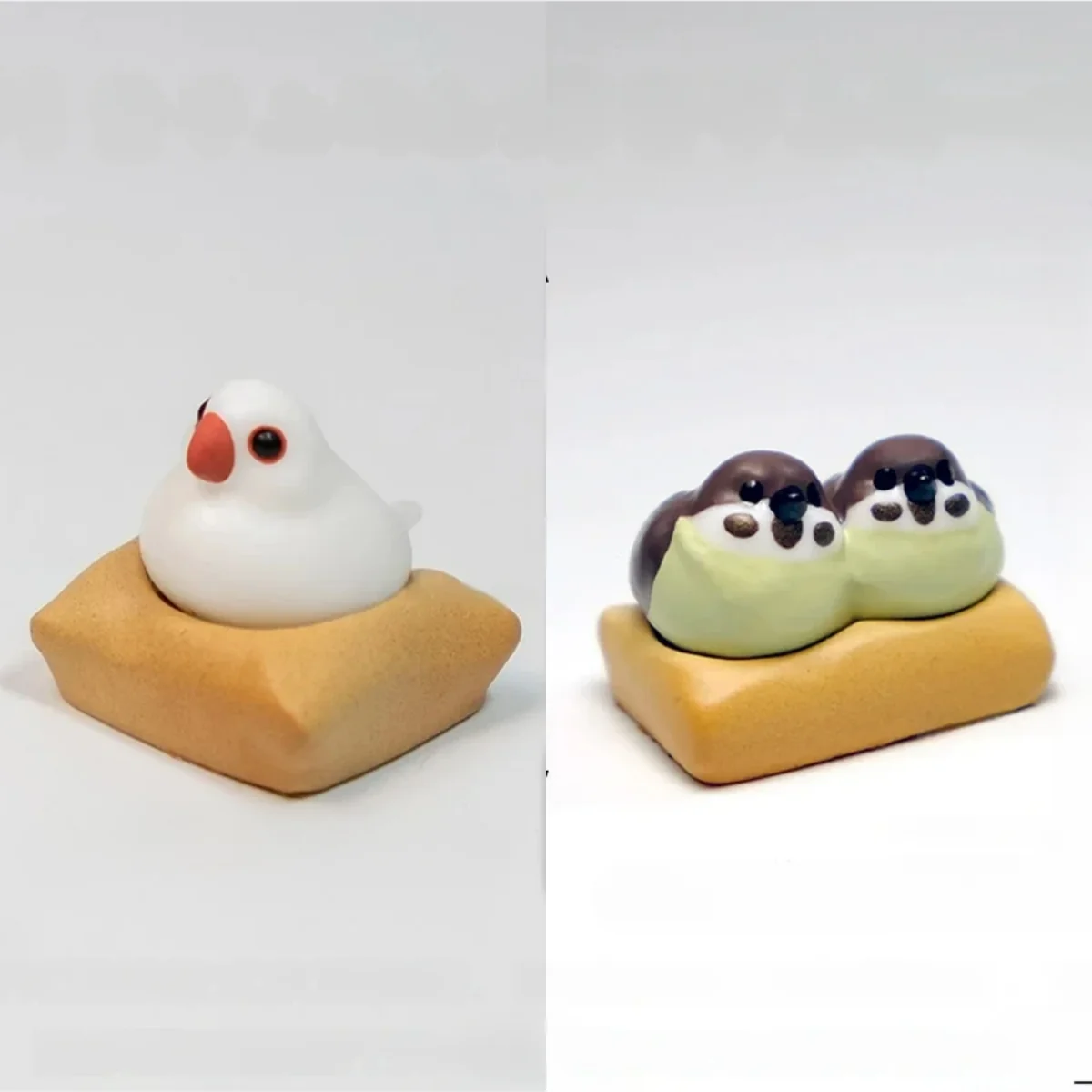 Exquisite handcrafted 3D artisan Java Sparrow keycap showcasing intricate miniature scenes of charming birds on a textured mat.