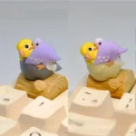 Exquisite hand-sculpted 3D artisan Purple Peony Cockatiel Keycaps featuring a whimsical purple peony and charming cockatiel, a unique miniature art piece.