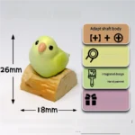 Close-up of a vibrant apple green parrot artisan keycap, showcasing a meticulously hand-sculpted 3D parrot design.