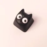Gallery views of the unique handmade Little Black Cat artisan resin ESC keycap, showcasing its whimsical design and intricate translucent craftsmanship.