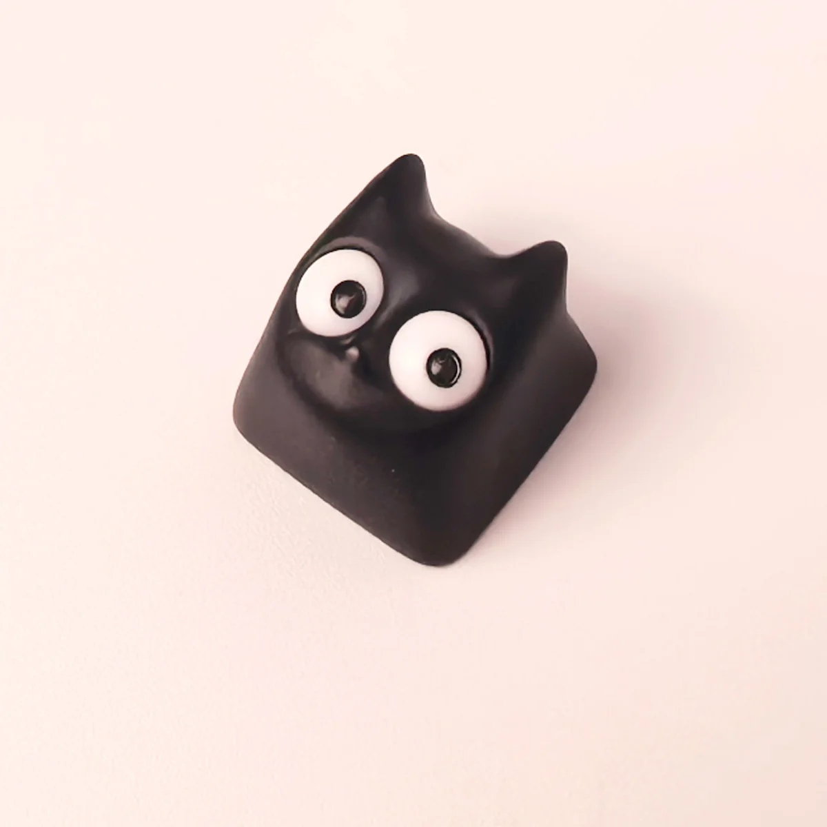 Gallery views of the unique handmade Little Black Cat artisan resin ESC keycap, showcasing its whimsical design and intricate translucent craftsmanship.