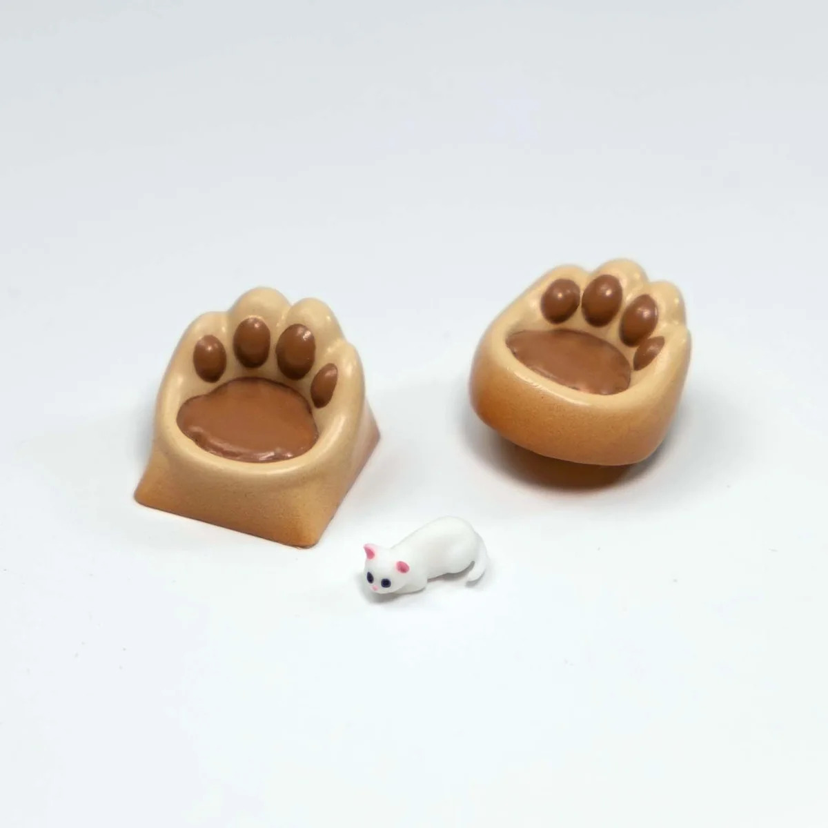 Whimsical handcrafted magnetic 3D Cat Paw Sofa Artisan Keycaps detail, showcasing the miniature white cat with blue eyes on its cozy sofa from a delightful new design.