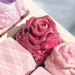 Exquisite handcrafted rose artisan keycaps, multiple angles revealing delicate resin roses in clear and tinted resin, a romantic garden for your keyboard.