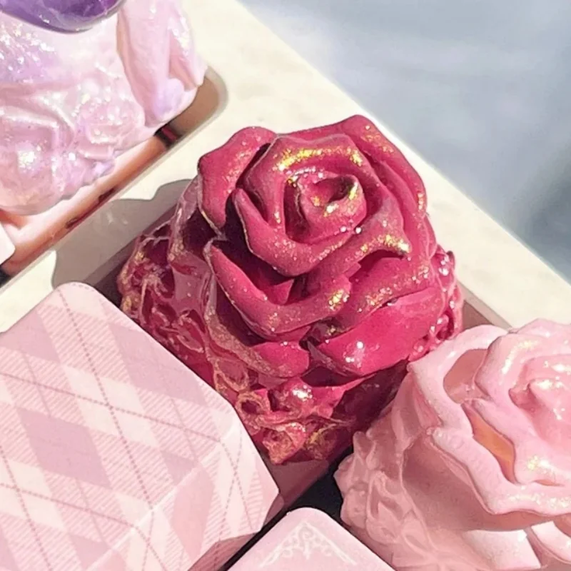 Exquisite handcrafted rose artisan keycaps, multiple angles revealing delicate resin roses in clear and tinted resin, a romantic garden for your keyboard.