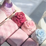 Exquisite handcrafted rose artisan keycap showcasing a delicate resin rose perfectly embedded in clear resin, evoking a romantic garden aesthetic.