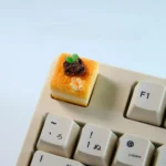 Handcrafted mousse cake artisan keycap showcasing its unique dessert-inspired design. Whimsical, vibrant pastel colors and realistic texture from all angles.
