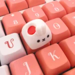 Whimsical artisan rabbit ESC keycap gallery showcasing its handcrafted strawberry design and tactile embossed texture from various angles, a true delight setup.