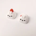 Whimsical artisan rabbit ESC keycap, handcrafted with a charming strawberry design and tactile embossed texture for a delightful desk accent.