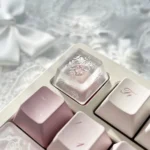 Artisan Snowflake Keycap gallery showcasing multiple angles of the handcrafted translucent resin snowflake. Ethereal, misty details glow softly.