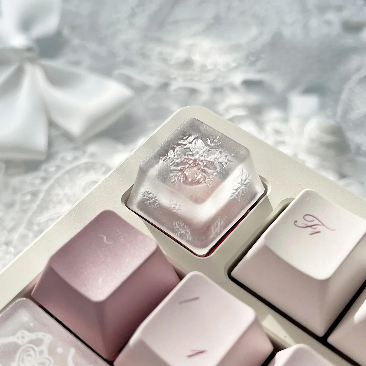 Artisan Snowflake Keycap gallery showcasing multiple angles of the handcrafted translucent resin snowflake. Ethereal, misty details glow softly.