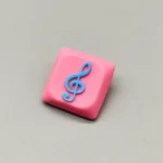 Vibrant pink base Treble Clef Low Shaft Keycaps, handcrafted from resin, showcasing a glossy treble clef symbol.