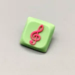 Treble Clef Low Shaft Keycaps featuring a vibrant treble clef on a playful green base, a unique musical note accessory.