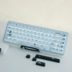 Astronaut PBT MOA keycap set, showcasing durable PBT and ergonomic profile. Cosmic artistry with stylized astronauts and deep space hues is visible.