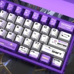 Vibrant Aurora Keycap Set close-up, revealing its shimmering pearlescent metallic finish. Cosmic purples and blues reflect light from a dynamic angle.