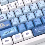 Close-up views of the elegant Ayato keycap set, showcasing its exclusive Genshin Impact Kamisato Ayato custom design from multiple artistic angles.