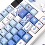 A collection of artistic Ayato Keycap Set images, showcasing the exclusive Genshin Impact Kamisato Ayato custom design from multiple elegant angles.