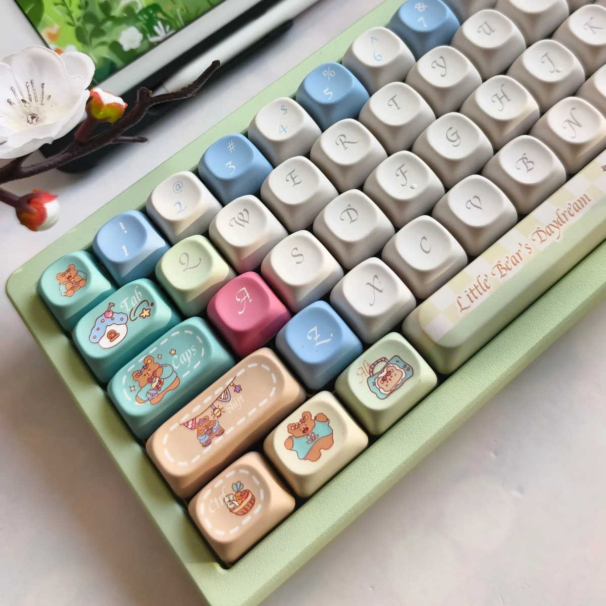 Close-up of a Bear Daydream PBT keycap set, showcasing its unique whimsical bear art and vibrant, imaginative dream scene.