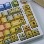 Close-up of playful BearisBug PBT dye-sub keycaps set from multiple angles, showcasing the whimsical creature design and vibrant, soft colors.