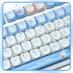 White Rabbit MOA PBT keycaps set from an angled view, revealing the comfy spherical profile and iconic milky white, blue, and red candy motif.