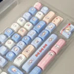 Playful White Rabbit MOA PBT keycaps set, featuring iconic milky white, blue, and red spherical profiles. Durable PBT, comfy MOA for nostalgic keyboard.