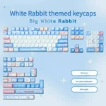 Playful White Rabbit MOA PBT keycaps set, featuring milky white, blue, and red keys with a comfy spherical profile for a nostalgic typing feel.