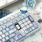 Ethereal blue butterfly KDA keycap set from multiple angles, showcasing its exquisite rose shadow design and intricate floral details. A dreamlike, artistic angles.