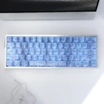 Exclusive Blue Forged Carbon Keycaps Set, shown from various angles. Highlights the unique blue forged carbon texture, sleek modern design, and side-printed design.