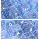 A close-up of the exclusive blue forged carbon texture PC keycaps set, featuring sleek side-printed legends and a modern, dynamic aesthetic.