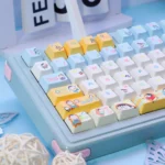 Bo-chan Daily Charm PBT Keycap Set gallery. Exclusive Crayon Shin-chan Bo-chan art in a serene blue, whimsical style, shown from multiple angles.